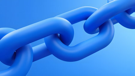 Close-up of thick, smooth, matte blue chain links interlocking against a solid blue background.の素材