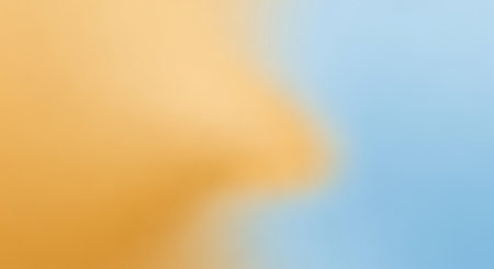 Soft blend of warm orange and light blue colors creating a smooth, diffused gradient effect.の素材