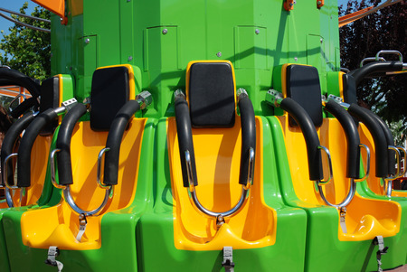 Seats of free fall tower in amusement parkの写真素材