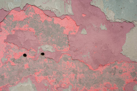 Peeling paint on old colorful wall backgroundの写真素材