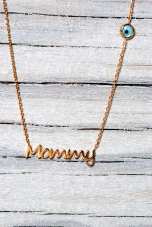 Necklace on old wooden tableの写真素材