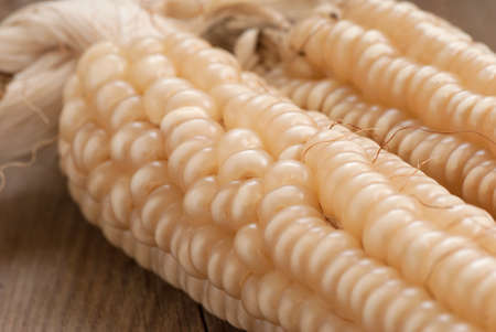White corn on old wooden tableの写真素材