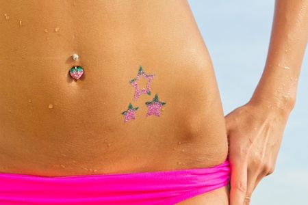 Woman posing with glitter-tattooの写真素材