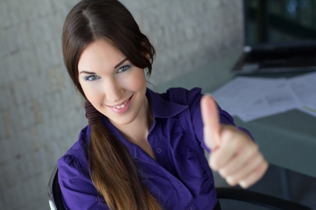 Businesswoman thumb upの写真素材