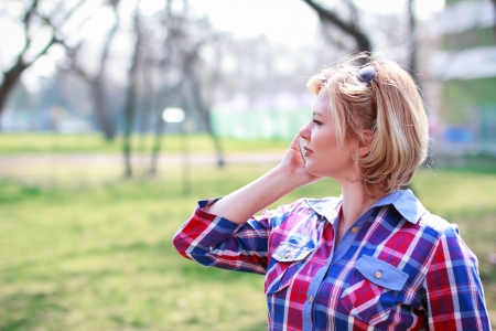 Fresh woman calling at outdoorの写真素材