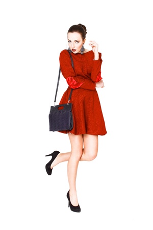 Brunette model posing leg up, isolatedの写真素材