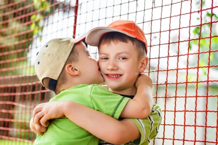 Little boy hug brotherの写真素材