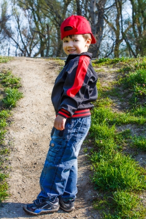 Little boy in red cap on riseの写真素材