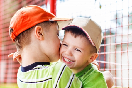 Happy little brothers, teeth smile, outdoorの写真素材