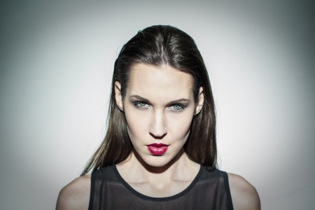 Brunette high fashion model portrait at wallの写真素材