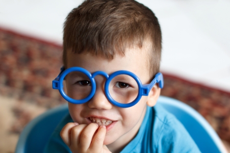 Little cleaver boy in plastic glasses, knowledgeの写真素材