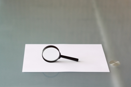 Magnifying glass with blank document, officeの写真素材