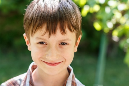 Little preschooler boy smile at outdoorの写真素材
