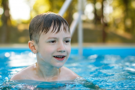 Little boy smile in swimming pool, closeupの写真素材