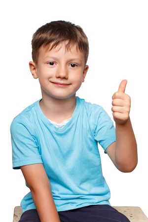 Young boy thumb up, isolatedの写真素材