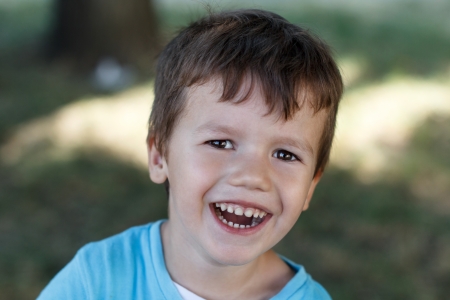 Little boy with teeth smile, outdoorの写真素材