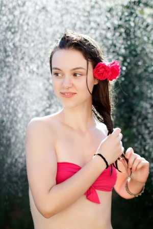 Young woman in the shower, outdoorの写真素材