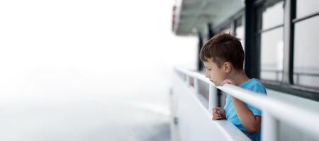 Little boy on cruise ship, empty spaceの写真素材