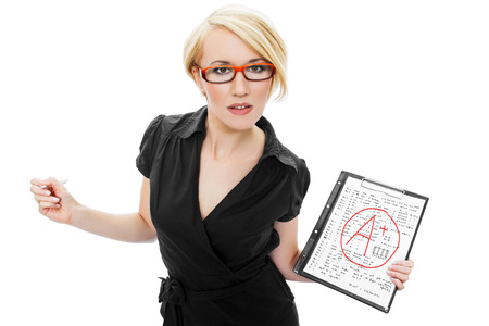 Blonde teacher in glasses holding test, A+ grade, passedの写真素材