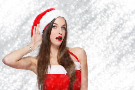 Sexy woman listening wishes, Christmasの写真素材