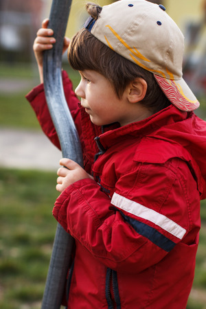 Little boy at outdoor with pole, jungle gymの写真素材