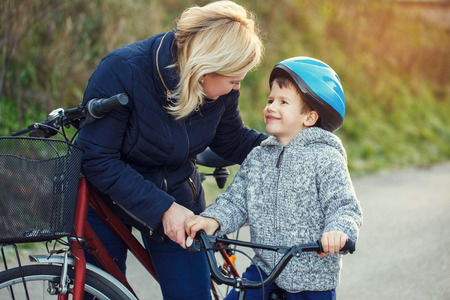 Family of mother and son bikingの写真素材
