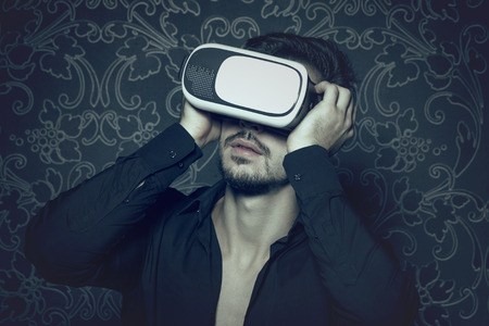 Young caucasian man in virtual reality headset enjoying simulation, in cinematic style