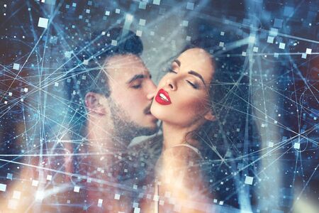 Sensual lovers foreplay indoor. Hot milf with young macho lover, with connections, online sex and dating conceptの写真素材