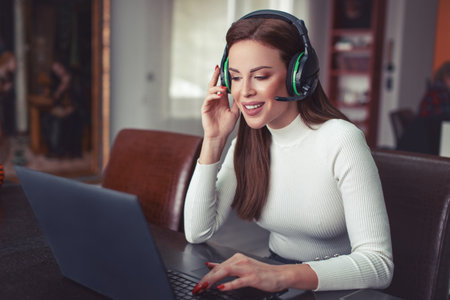 Young positive woman with headset talking online, customer support