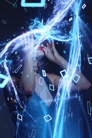 Sexy woman with red lips and headset enjoying virtual reality at night in energy streamの写真素材