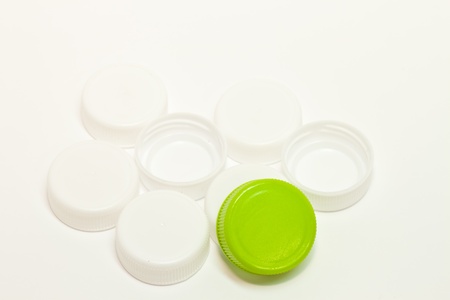 Pile of bottle caps Bottle of white and green の写真素材