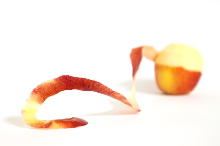 red peeled apple.apple on whie backgrond.の写真素材
