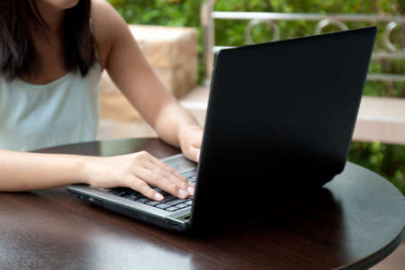 Asian woman working on laptop