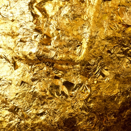 Gold leaf on buddha sculpture background.の写真素材