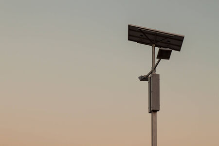 Electricity post and Solar cells on sky.の写真素材