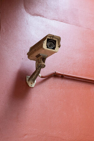 CCTV on a red wallの写真素材