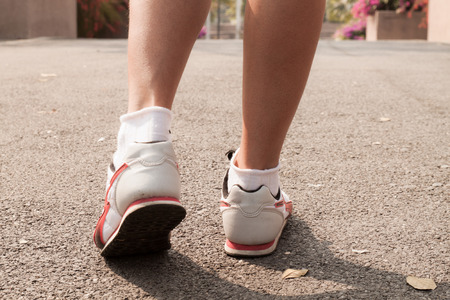 Runner Feet Running on roadの写真素材