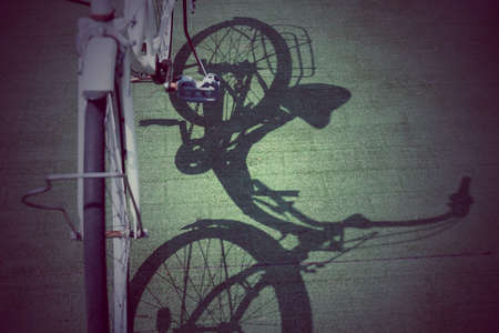 Vintage bicycle with shadow on floor,vintage styleの写真素材