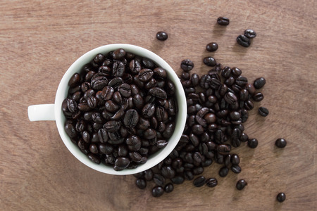 coffee beans in coffee cupの写真素材