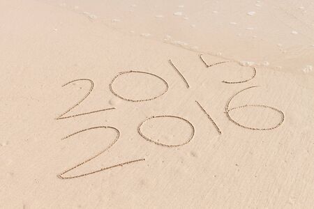 new year for 2016 written in sand,New Year 2016 is coming concept