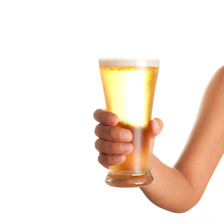 hand holding up a glass of beer on white backgroundの写真素材