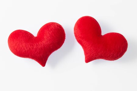 two red heart made of fur   on white backgroundの写真素材