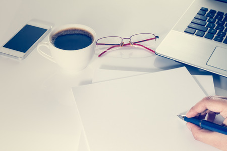Businessman working on  table with laptop and coffee cupの写真素材