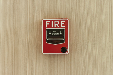 Fire alarm on wood wall