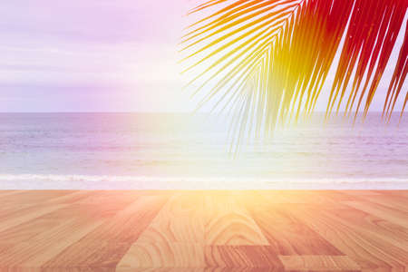 empty wood table for product display with sea and palm tree with blue skyの写真素材
