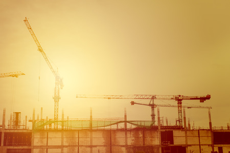 Industrial construction landscape with cranes on the sky background,in colorful soft styleの写真素材