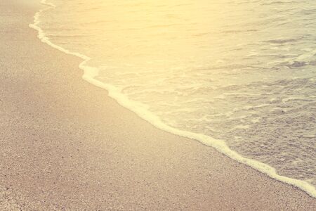 close up soft wave on sand at the beach in vintage style