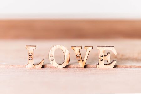 The word Love on  wooden backgroundの写真素材