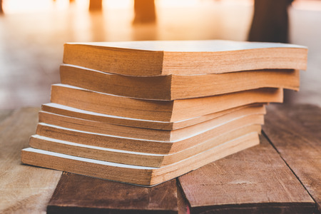 stack of old books on wooden tableの写真素材