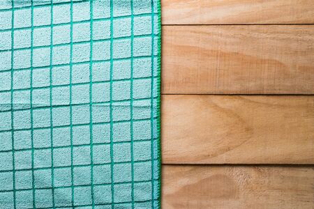 green tablecloth on wood background,top view,empty wooden table for product displayの写真素材